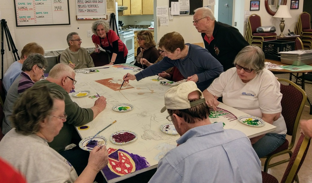 Seniors at the Taylor Community Center worked with Heart to Art a local arts group to work on a community mural to hang in their center.