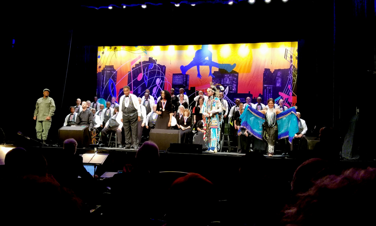 Veterans Feet Jensen, Bruce Glover, and Joy Banks lead the 2018 Festival Chorus in the performance of “This is Me” during the National Veterans Creative Arts Festival Stage Show at the historic Hoyt Sherman Place in Des Moines, Iowa.