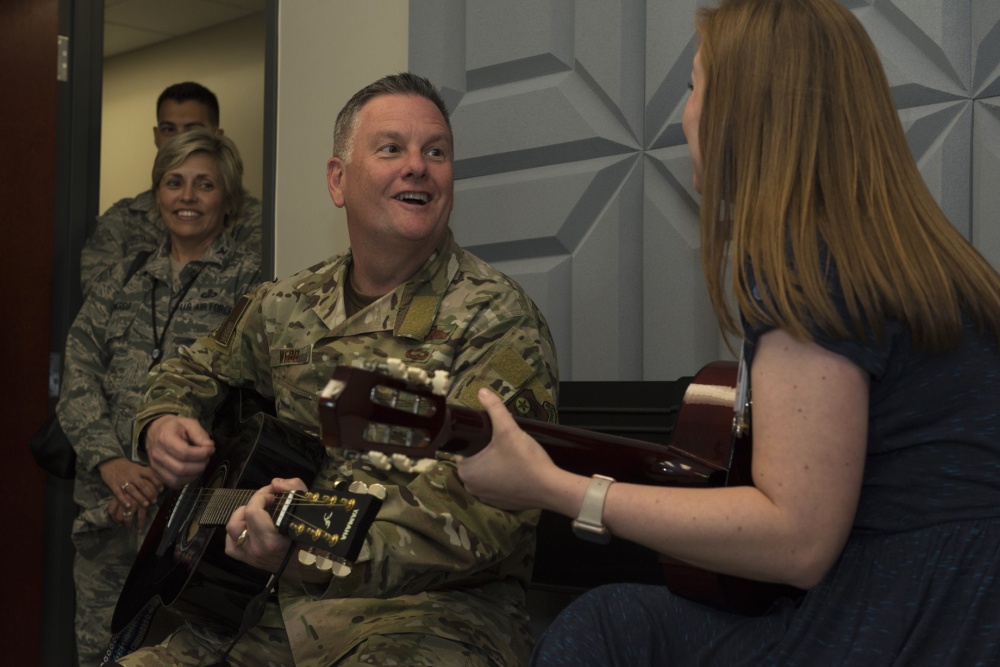 U.S. Air Force Lt. Gen. Brad Webb, commander of Air Force Special Operations Command, participates in a music therapy demonstration with Sally Jones, Invisible Wounds Center music therapist, at Eglin Air Force Base, Florida Oct. 29, 2018. The Invisible Wounds Center provides music therapy for those receiving treatment for traumatic brain injury, post-traumatic stress and pain. (U.S. Air Force photo by Staff Sgt. Lynette M. Rolen)