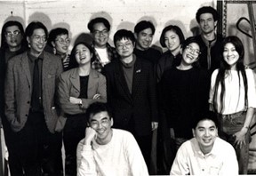 Godzilla, ca. 1994. Photo by Tom Finkelpearl, courtesy of Tomie Arai. Description: A black and white photo of a group of smiling people.